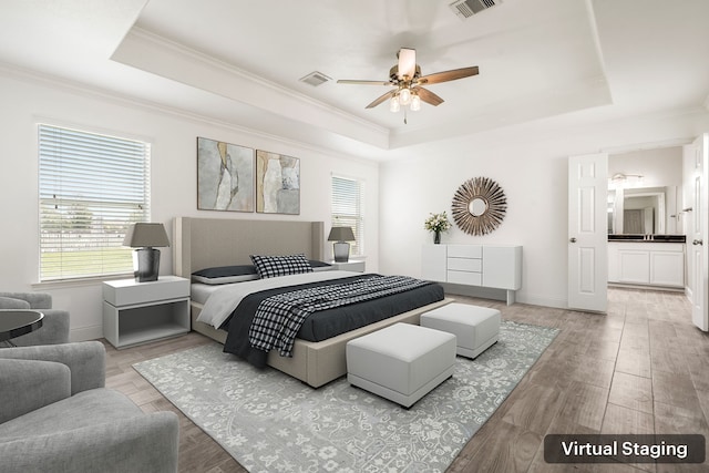 14910 High Meadow Ln, Baytown, TX 77523 - bedroom with a tray ceiling, ornamental molding, wood finished floors, and ceiling fan