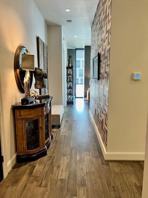 1211 Caroline St Unit 1007, Houston, TX 77002 - corridor featuring wood finished floors, recessed lighting, and floor to ceiling windows