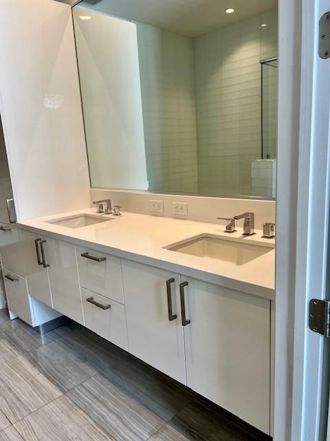 1211 Caroline St Unit 1007, Houston, TX 77002 - bathroom featuring double vanity