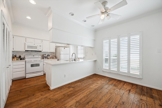 5940 Woodway Place Ct, Houston, TX 77057 - kitchen with white appliances, ornamental molding, a peninsula, light countertops, and white cabinetry
