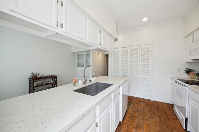 5940 Woodway Place Ct, Houston, TX 77057 - kitchen with white appliances, ornamental molding, recessed lighting, white cabinetry, and dark wood-style floors