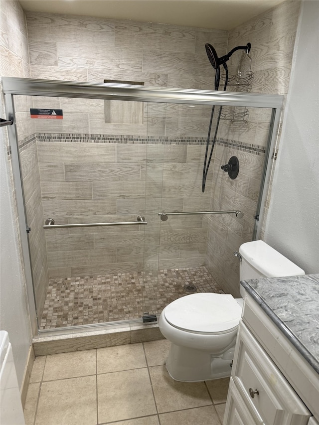7555 Katy Fwy Unit 57, Houston, TX 77024 - full bathroom featuring vanity, a shower stall, and tile patterned flooring