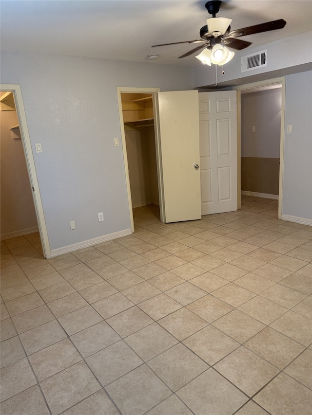 7555 Katy Fwy Unit 57, Houston, TX 77024 - unfurnished bedroom with a spacious closet, a closet, and a ceiling fan
