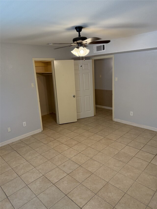 7555 Katy Fwy Unit 57, Houston, TX 77024 - unfurnished bedroom with a walk in closet, a closet, and ceiling fan