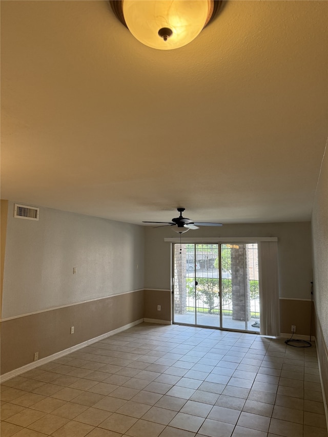 7555 Katy Fwy Unit 57, Houston, TX 77024 - spare room featuring light tile patterned floors and a ceiling fan