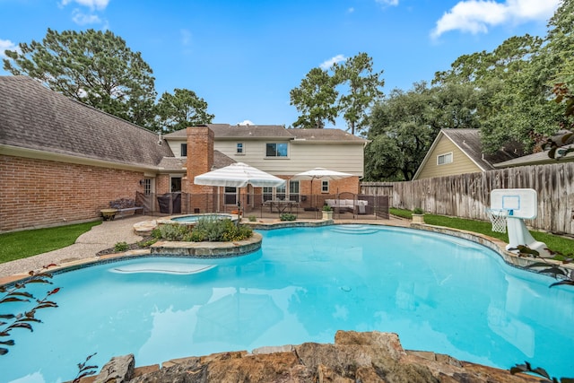 9727 Godstone Ln, Spring, TX 77379 - view of pool with an in-ground hot tub, a fenced backyard, and a patio