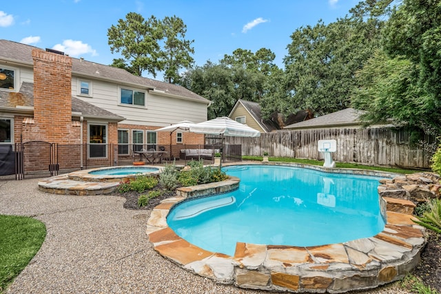9727 Godstone Ln, Spring, TX 77379 - view of pool with an in-ground hot tub, a fenced backyard, and a patio