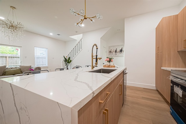 4504 Rosemont St, Houston, TX 77051 - kitchen with a chandelier, modern cabinets, light wood-type flooring, range with electric stovetop, and recessed lighting