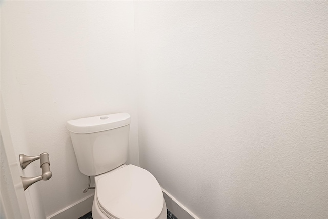 4504 Rosemont St, Houston, TX 77051 - bathroom featuring baseboards and toilet
