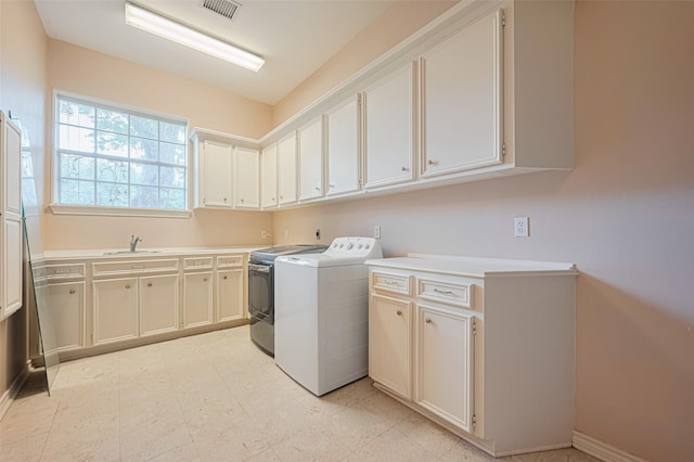 3665 Maranatha Dr, Sugar Land, TX 77479 - washroom featuring cabinet space, washer and dryer, and light flooring