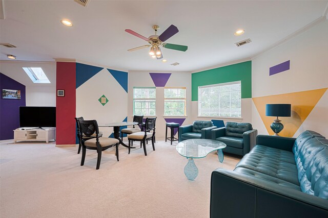 3665 Maranatha Dr, Sugar Land, TX 77479 - living area featuring ornamental molding, a skylight, light carpet, recessed lighting, and a ceiling fan