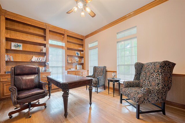 3665 Maranatha Dr, Sugar Land, TX 77479 - office featuring ornamental molding, built in shelves, a ceiling fan, wainscoting, and light wood-type flooring