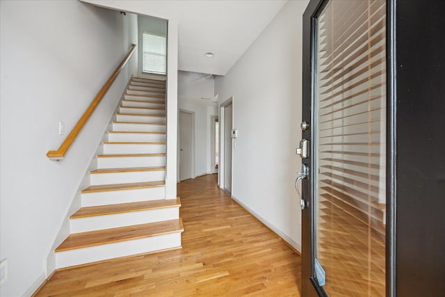 5219 Kiam St Unit F, Houston, TX 77007 - entrance foyer with light wood-style flooring and stairway