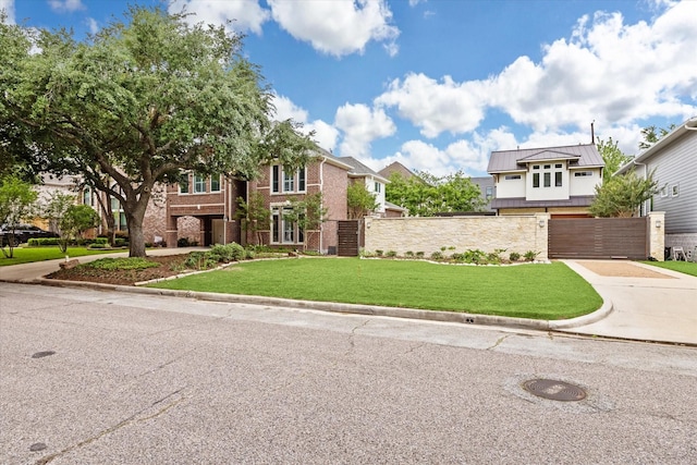 4404 Wendell St, Bellaire, TX 77401 - view of front of property with a standing seam roof, a metal roof, and brick siding