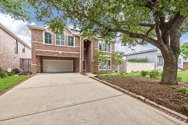 4404 Wendell St, Bellaire, TX 77401 - traditional-style house featuring brick siding, an attached garage, and driveway