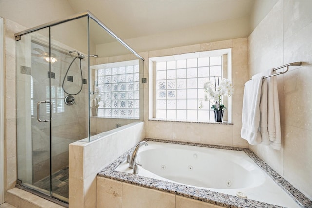 4404 Wendell St, Bellaire, TX 77401 - bathroom with plenty of natural light, a shower stall, and a tub with jets