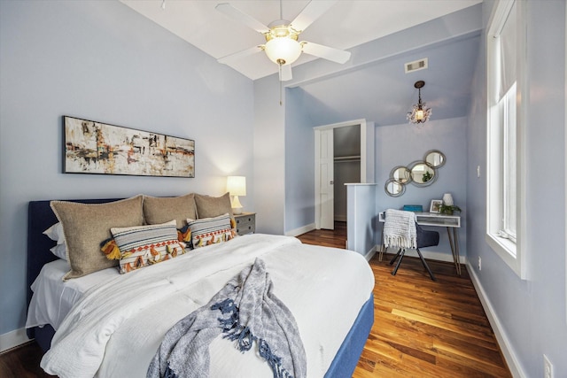 4404 Wendell St, Bellaire, TX 77401 - bedroom featuring wood finished floors, vaulted ceiling, and ceiling fan