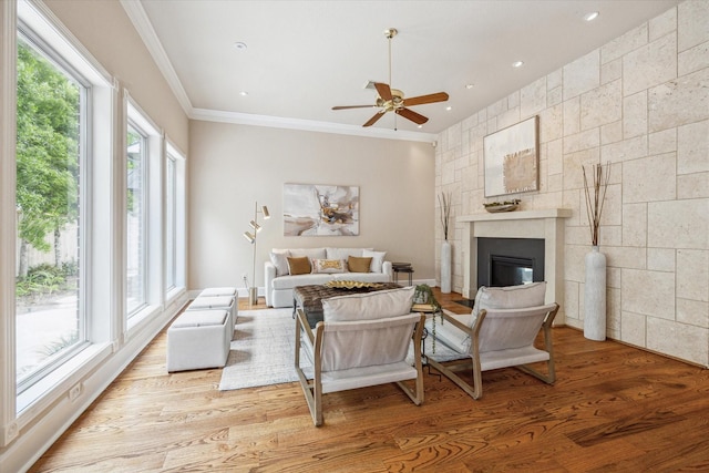 4404 Wendell St, Bellaire, TX 77401 - bedroom featuring wood finished floors, crown molding, a glass covered fireplace, and recessed lighting