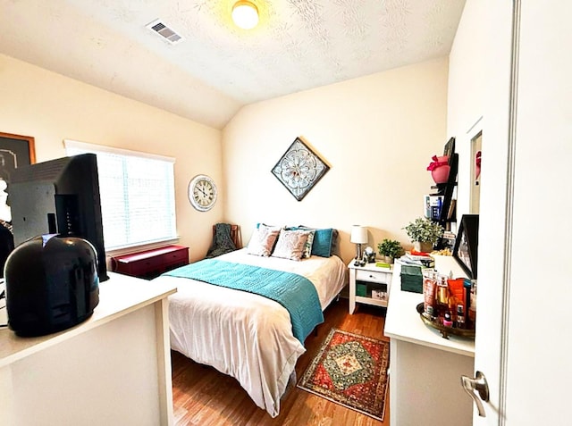 8010 N Tarrytown Crossing Dr, Conroe, TX 77304 - bedroom featuring wood finished floors and vaulted ceiling