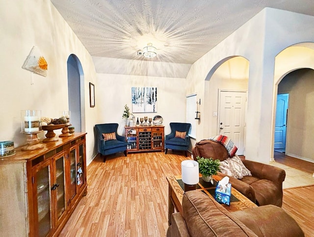 8010 N Tarrytown Crossing Dr, Conroe, TX 77304 - living area featuring arched walkways and light wood-type flooring