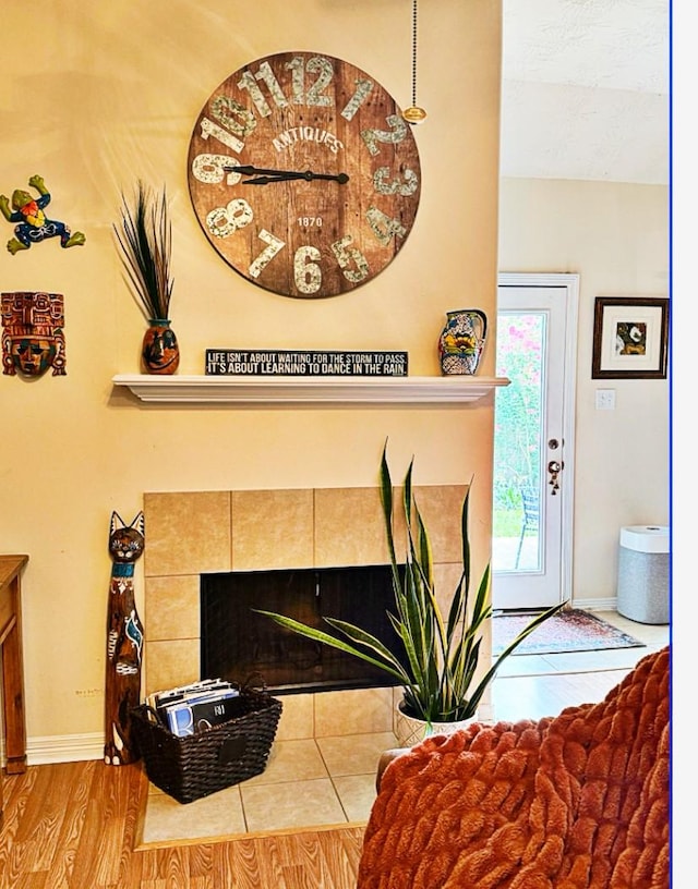 8010 N Tarrytown Crossing Dr, Conroe, TX 77304 - detailed view of a tile fireplace and wood finished floors
