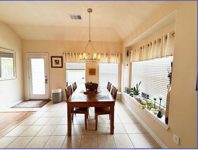 8010 N Tarrytown Crossing Dr, Conroe, TX 77304 - dining area featuring a chandelier and light tile patterned floors
