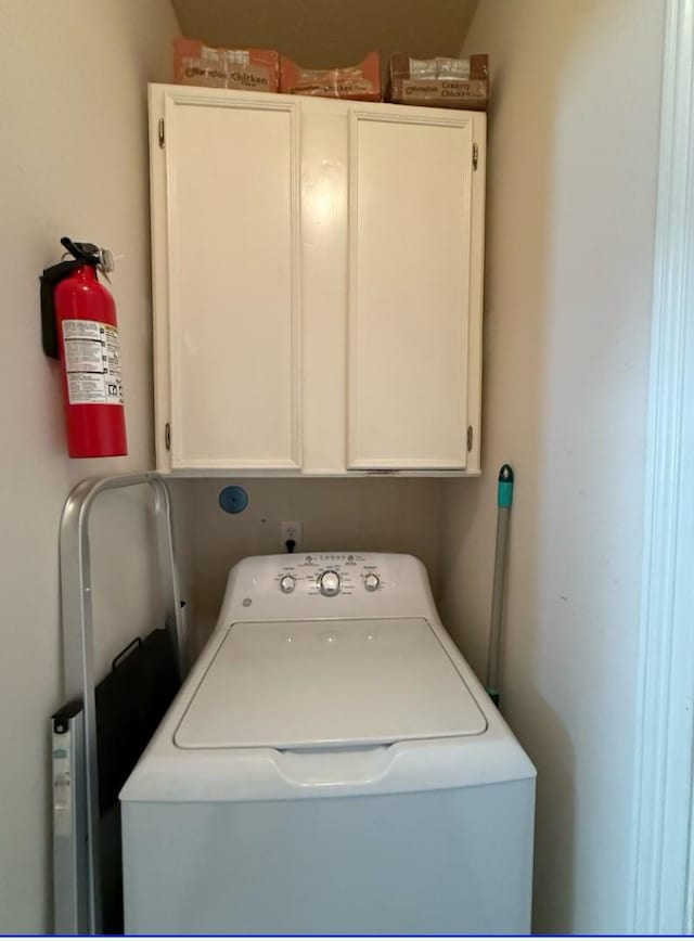 8010 N Tarrytown Crossing Dr, Conroe, TX 77304 - laundry room with washer / clothes dryer and cabinet space