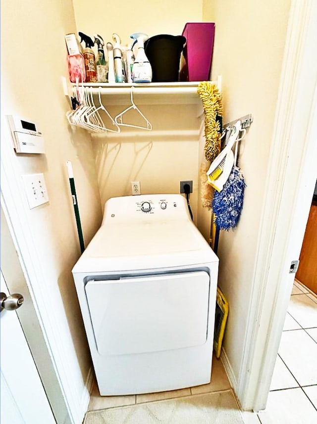 8010 N Tarrytown Crossing Dr, Conroe, TX 77304 - washroom featuring washer / clothes dryer and light tile patterned flooring