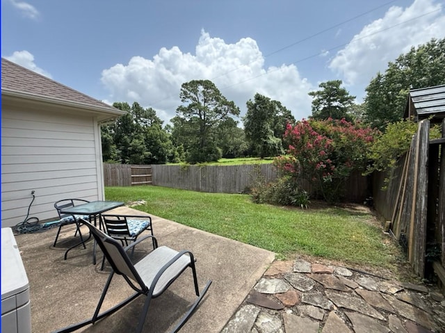8010 N Tarrytown Crossing Dr, Conroe, TX 77304 - fenced backyard featuring a patio and outdoor dining space