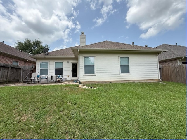 8010 N Tarrytown Crossing Dr, Conroe, TX 77304 - back of house featuring a patio, a fenced backyard, and a chimney