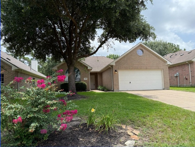 8010 N Tarrytown Crossing Dr, Conroe, TX 77304 - ranch-style house with concrete driveway, a garage, a front lawn, and brick siding