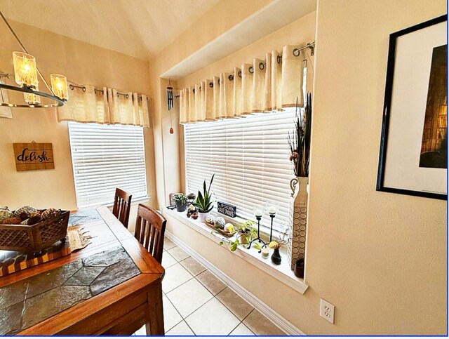 8010 N Tarrytown Crossing Dr, Conroe, TX 77304 - dining space featuring light tile patterned floors and a chandelier