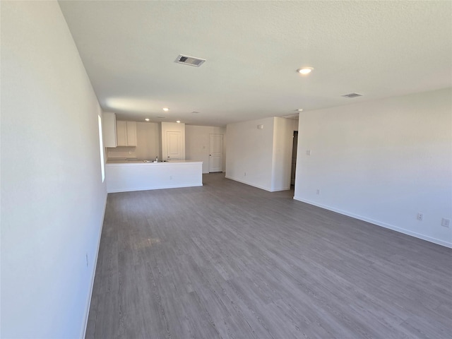 274 Douglas Hills Dr, Magnolia, TX 77354 - unfurnished living room with recessed lighting and dark wood-style floors