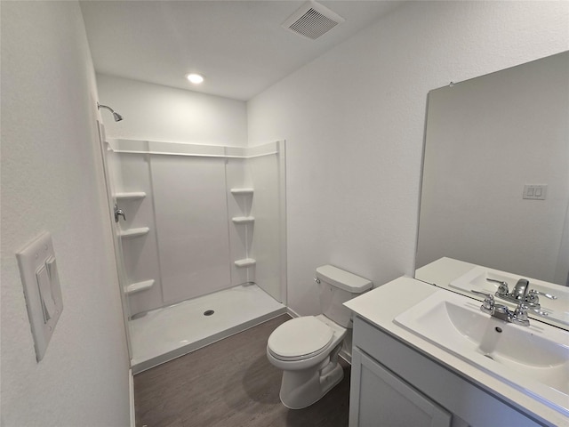 274 Douglas Hills Dr, Magnolia, TX 77354 - bathroom featuring vanity, a shower, and wood finished floors
