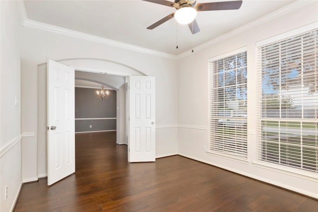 216 Willow Pointe Dr, League City, TX 77573 - unfurnished room featuring ornamental molding, dark wood-style floors, ceiling fan, a chandelier, and arched walkways