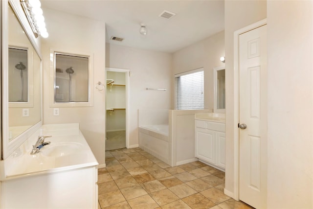 216 Willow Pointe Dr, League City, TX 77573 - full bath featuring a bath, two vanities, and a spacious closet