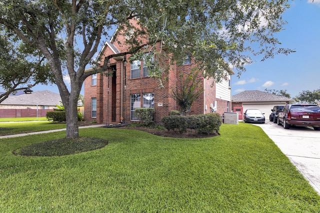 216 Willow Pointe Dr, League City, TX 77573 - view of front of property with brick siding, a front lawn, a garage, and driveway