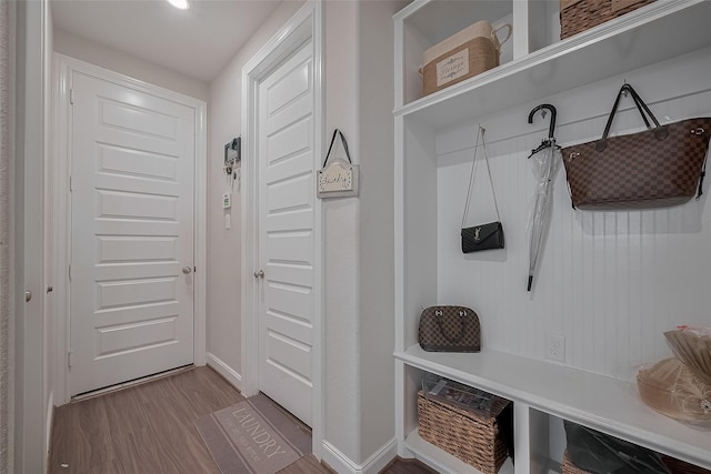 11527 Taagan Ln, Richmond, TX 77407 - mudroom featuring wood finished floors and baseboards