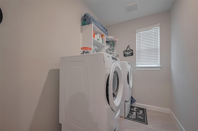 11527 Taagan Ln, Richmond, TX 77407 - laundry area with washer and dryer and baseboards