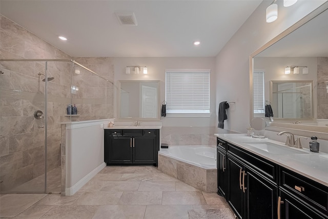 11527 Taagan Ln, Richmond, TX 77407 - bathroom with a bath, a shower stall, and two vanities
