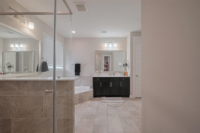 11527 Taagan Ln, Richmond, TX 77407 - bathroom featuring a bath, vanity, and a shower with door