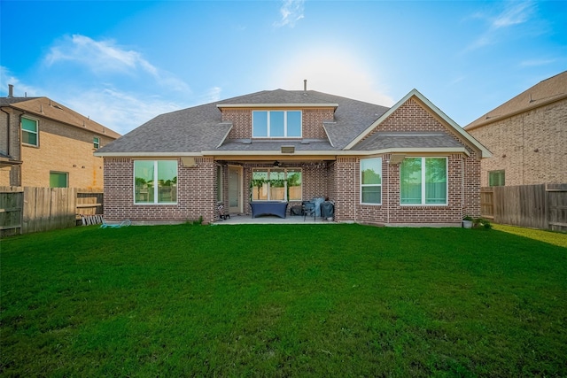 11527 Taagan Ln, Richmond, TX 77407 - rear view of property featuring a fenced backyard, brick siding, and a patio area