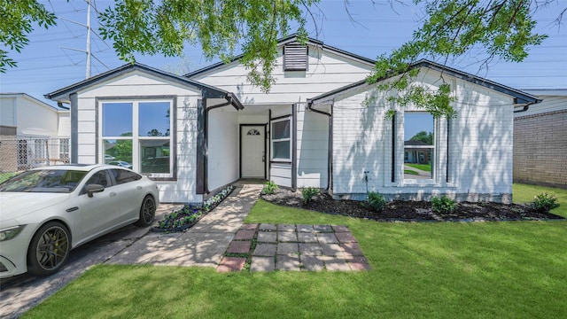 14223 Edenglen Dr, Houston, TX 77049 - ranch-style home featuring a front lawn