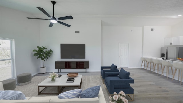 14223 Edenglen Dr, Houston, TX 77049 - living area with wood finished floors, a ceiling fan, and a towering ceiling
