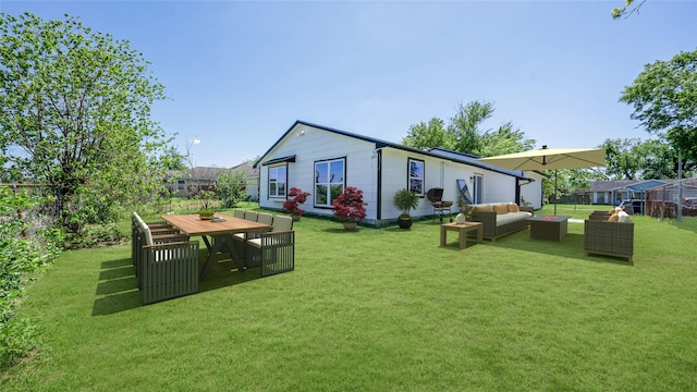 14223 Edenglen Dr, Houston, TX 77049 - rear view of property with an outdoor hangout area and a yard