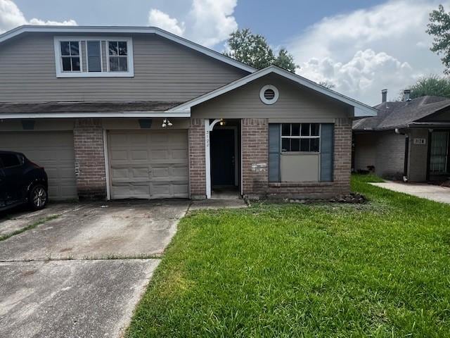 3122 Hirschfield Rd, Spring, TX 77373 - traditional-style house with brick siding, a front yard, an attached garage, and driveway