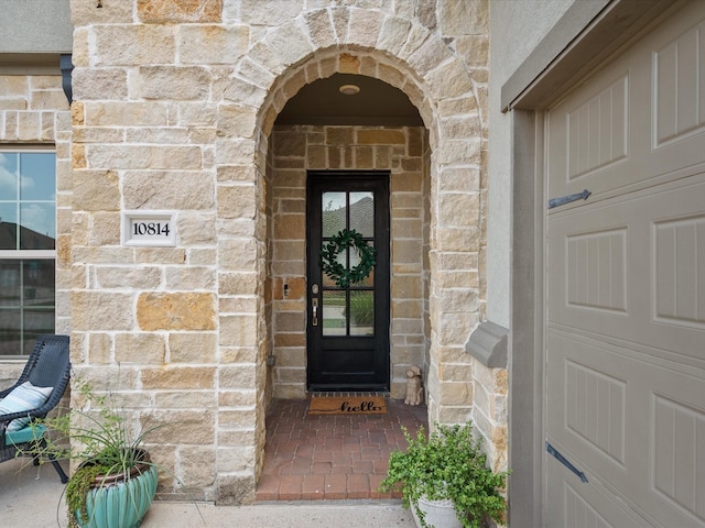 10814 Avery Arbor Ln, Cypress, TX 77433 - view of exterior entry featuring stone siding and brick siding