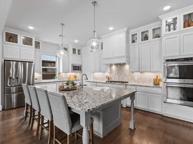 10814 Avery Arbor Ln, Cypress, TX 77433 - kitchen featuring stainless steel appliances, backsplash, white cabinets, dark wood-style flooring, and recessed lighting