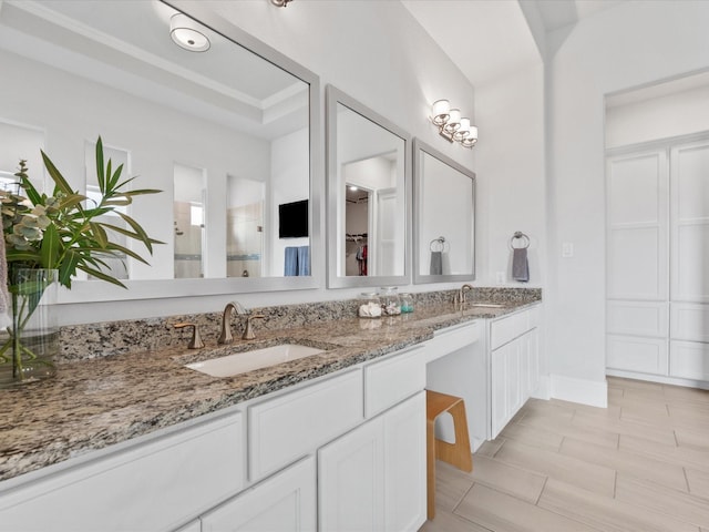 10814 Avery Arbor Ln, Cypress, TX 77433 - bathroom featuring double vanity and a tile shower