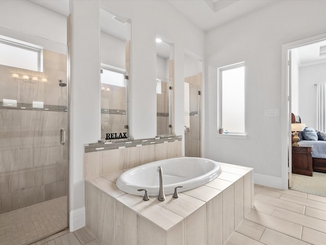 10814 Avery Arbor Ln, Cypress, TX 77433 - bathroom with a shower stall, a bath, plenty of natural light, and connected bathroom